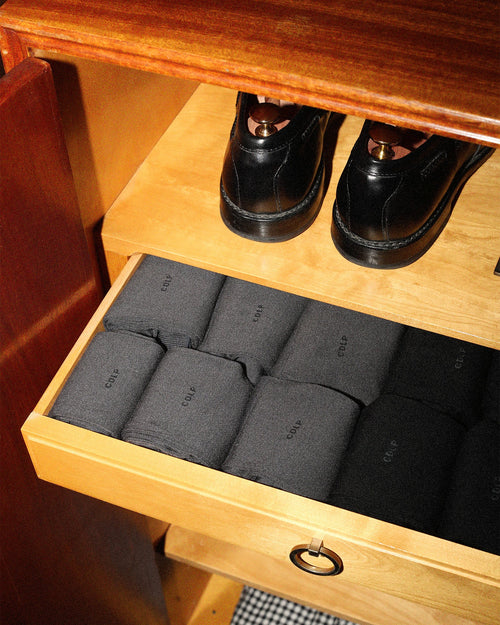 Mid-Length Socks in Charcoal grey folded in a drawer