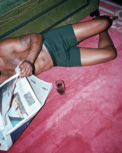 Marcus reading the newspaper wearing Lyocell Boxer Shorts in Army Green