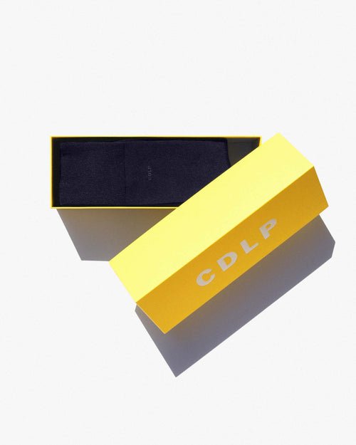 Bamboo Mid-Length Socks in Navy Blue in yellow signature box