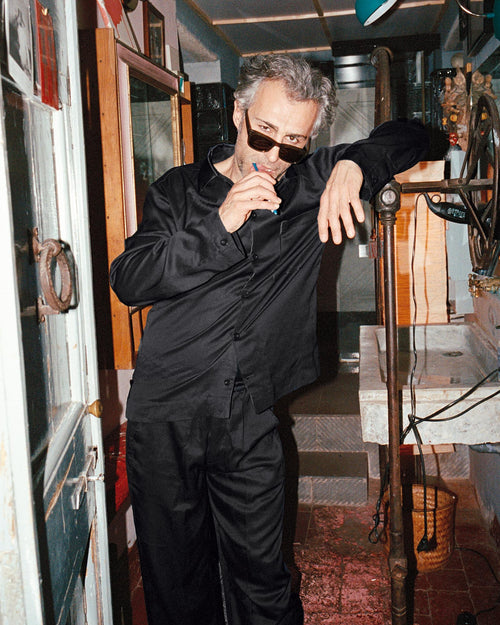Francesco brushing his teeth wearing Home Trousers in Black