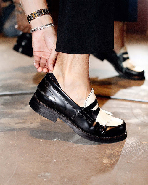 Jakob putting on a loafer when wearing Low-Cut Socks