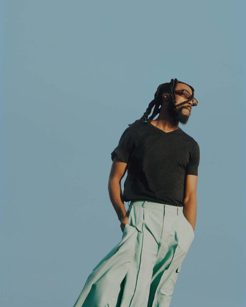 Brou standing outside in V-Neck T-Shirt in Black